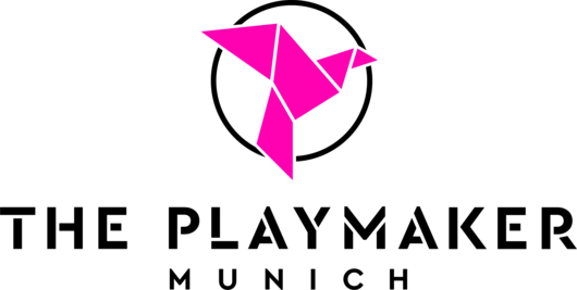 Origami-style pink bird, "THE PLAYMAKER MUNICH" in bold black text.